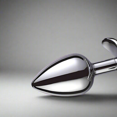 Weighted Butt Plug With Metal Anchor Base by Scandals showing tapered bullet tip design